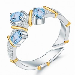 anillo con topacio azul