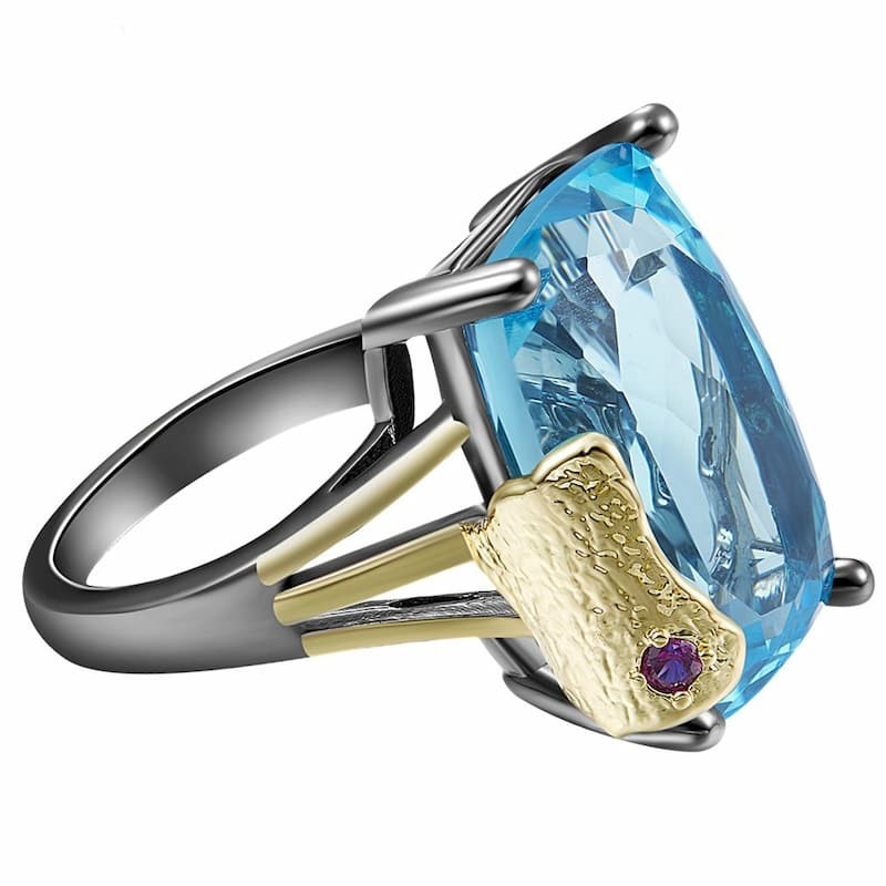anillo plateado con piedra azul